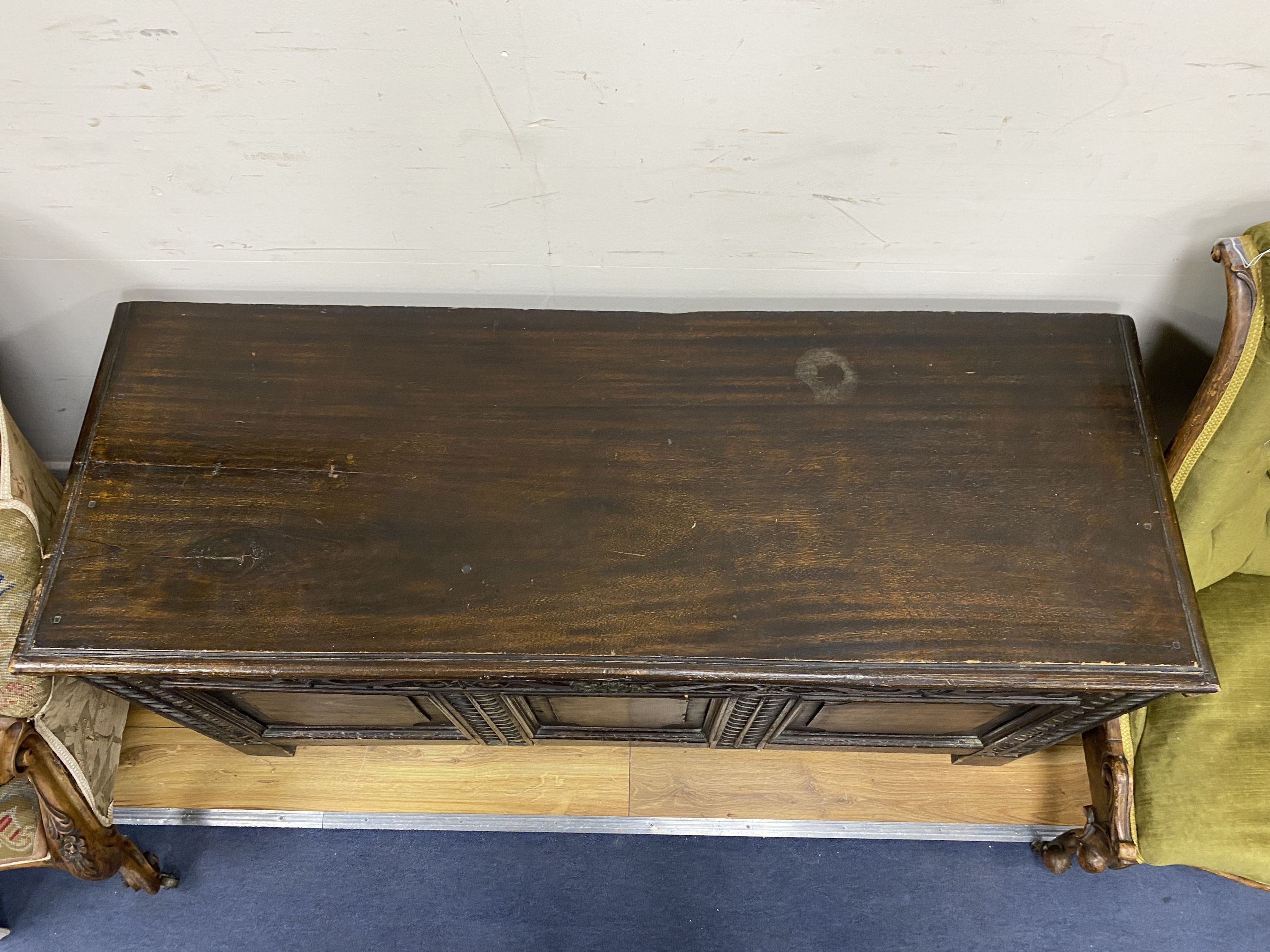 A 18th century style Cypriot carved wood panelled coffer, length 142cm, depth 51cm, height 67cm